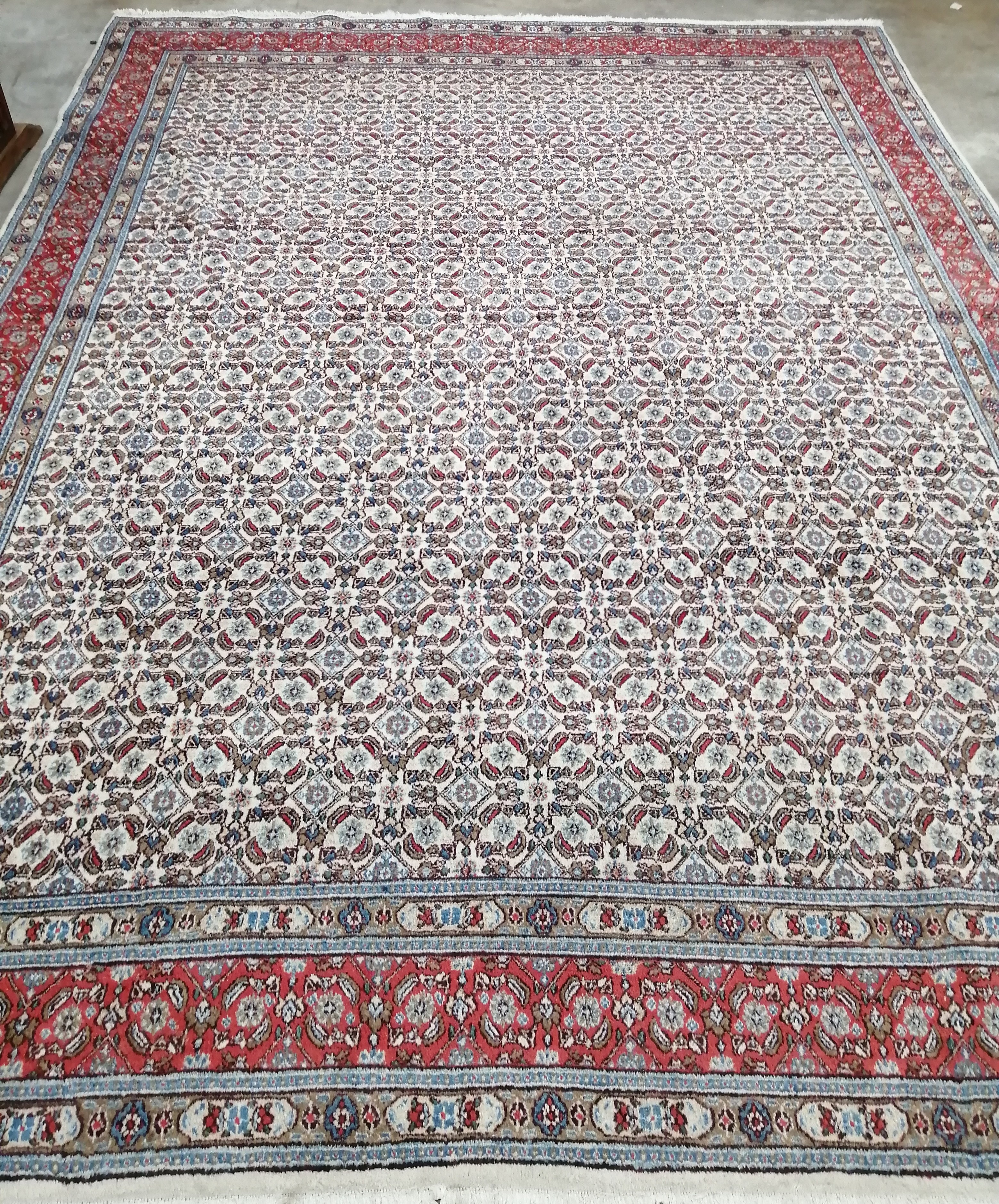 A North West Persian ivory ground carpet, 370 x 170cm